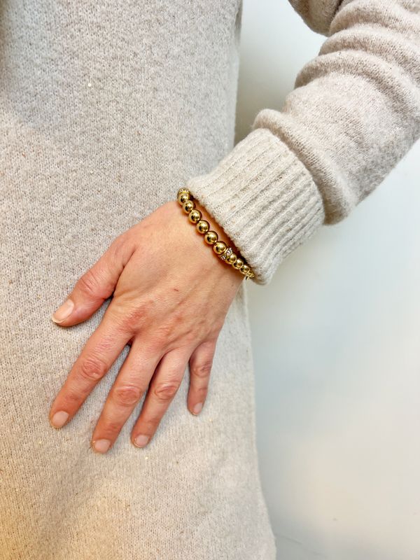 Armbånd i gull med krystaller og kuler